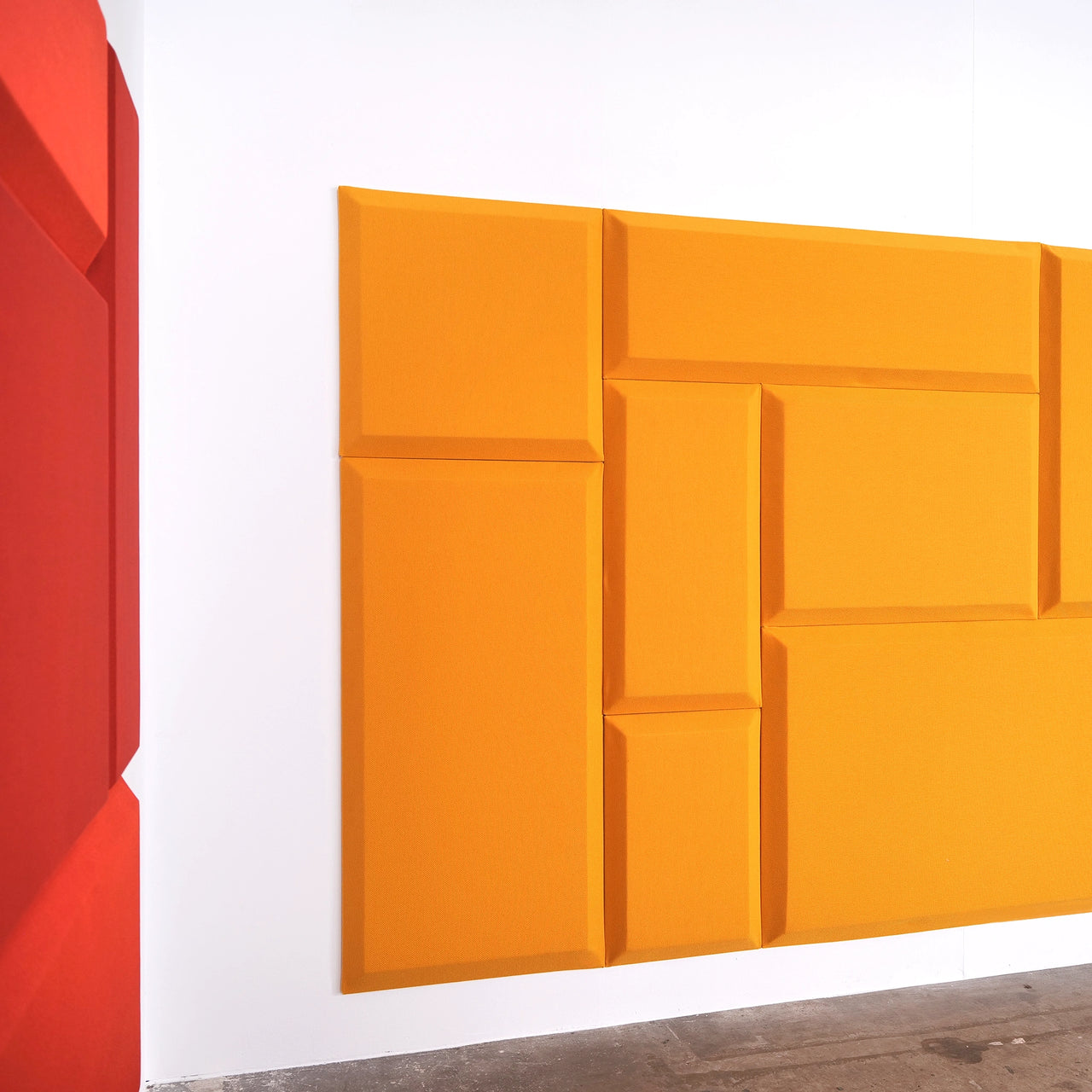 Wall installation made of geometric acoustic panels - an example of modular design and flexibility