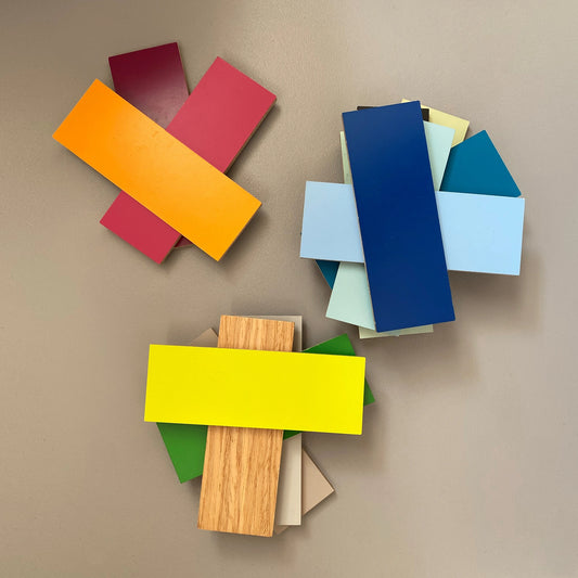 Arrangement of various paint samples and material samples for planning individual shelves