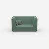 Modern two-seater sofa with high back from the front