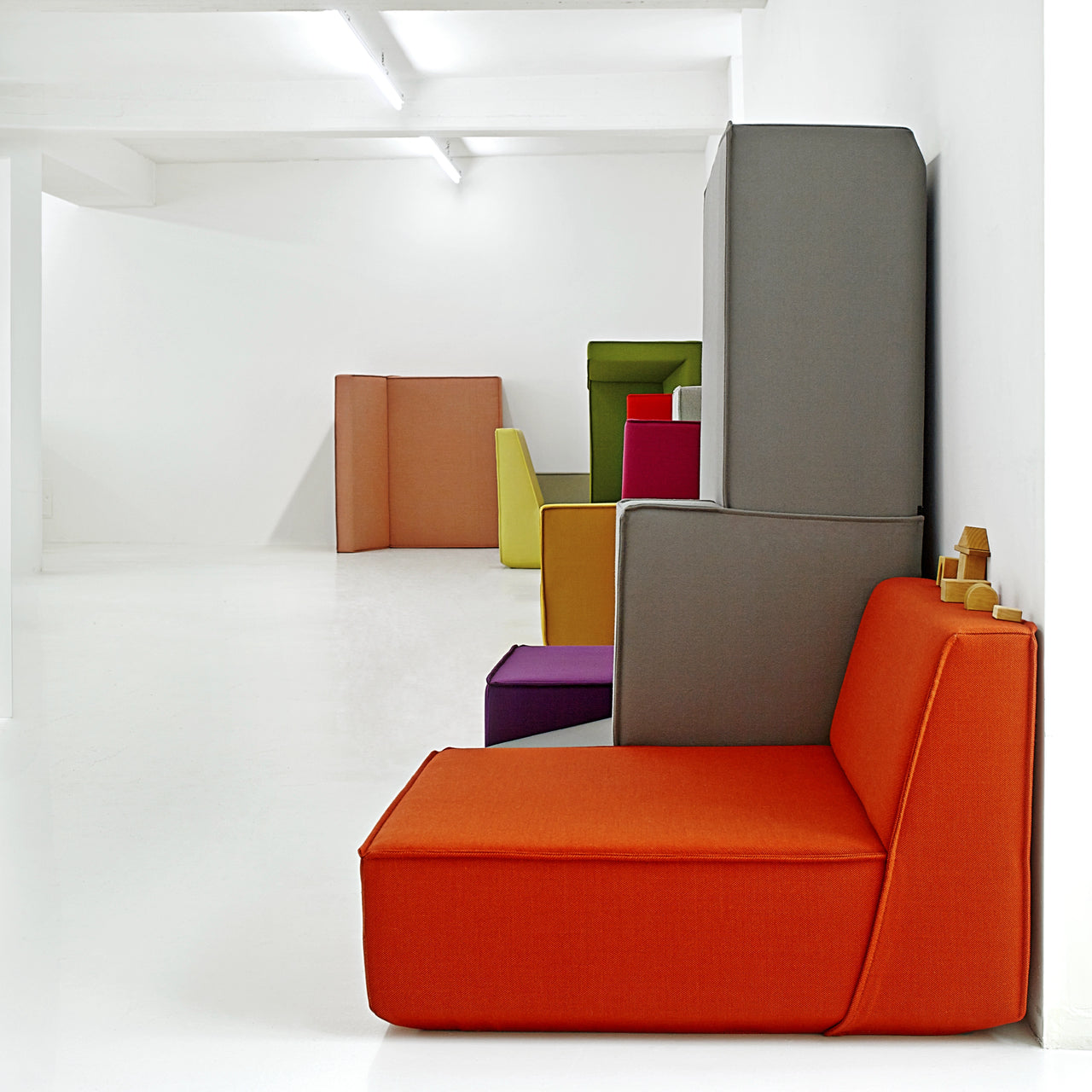 Installation of different colored Cubit sofa modules - artistically arranged