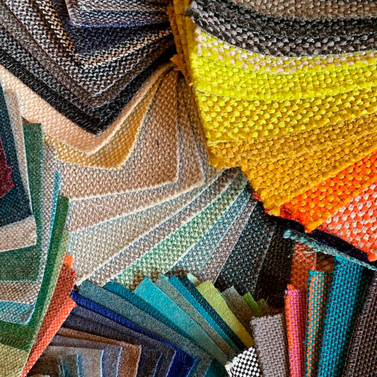 Large selection of fabric samples - sorted by colors and textures