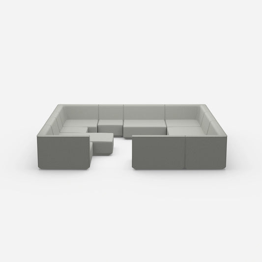 Îlot de canapé confortable dans des tons gris vu de face