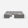 Îlot de canapé confortable dans des tons gris vu de face